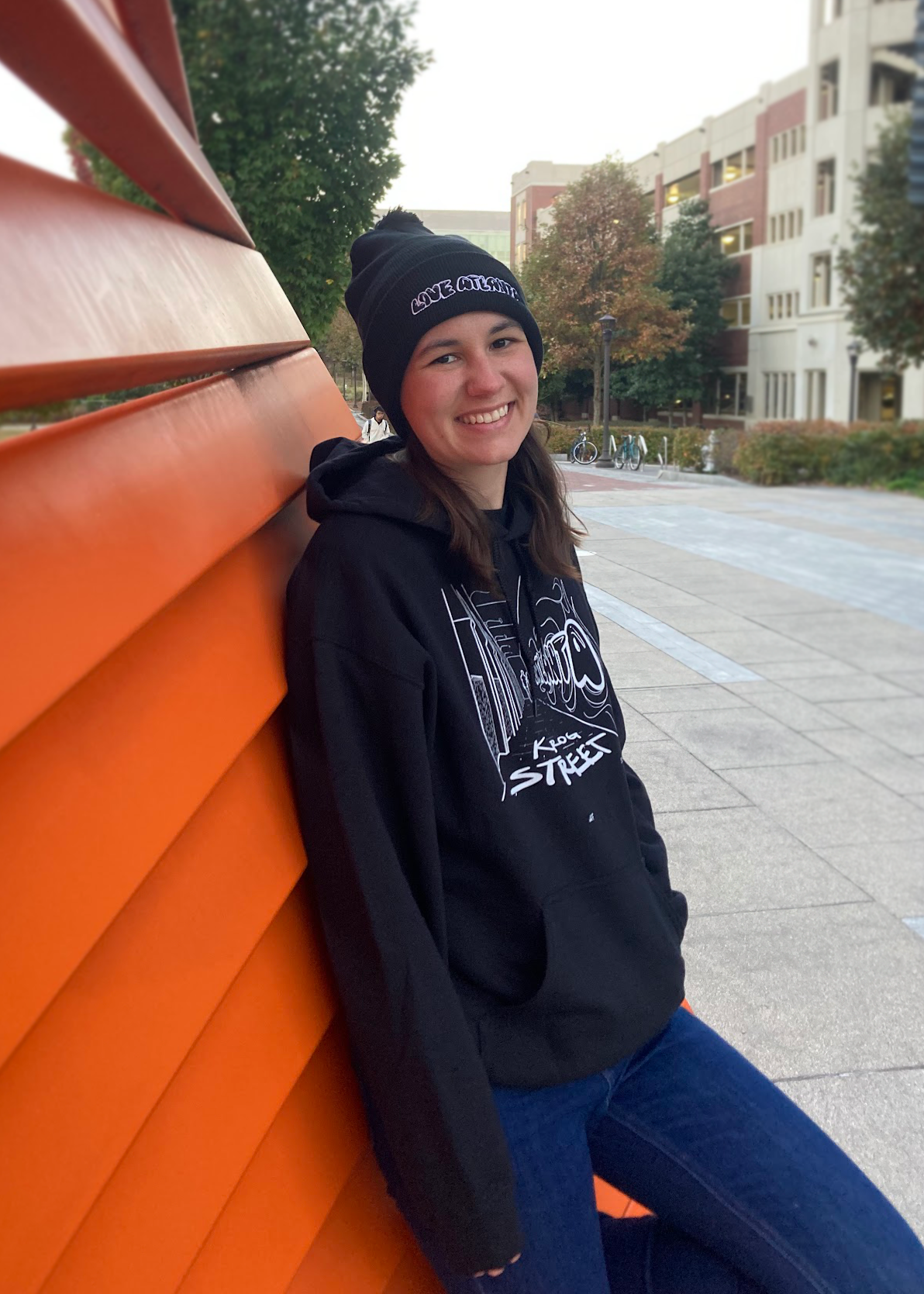 Model wearing Love Atlanta Pom-Pom Beanie and Krog St Tunnel Hoodie